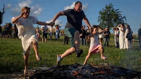 curfew kisscartoon|Under curfew, Ukrainians mark midsummer with bonfire jumping .